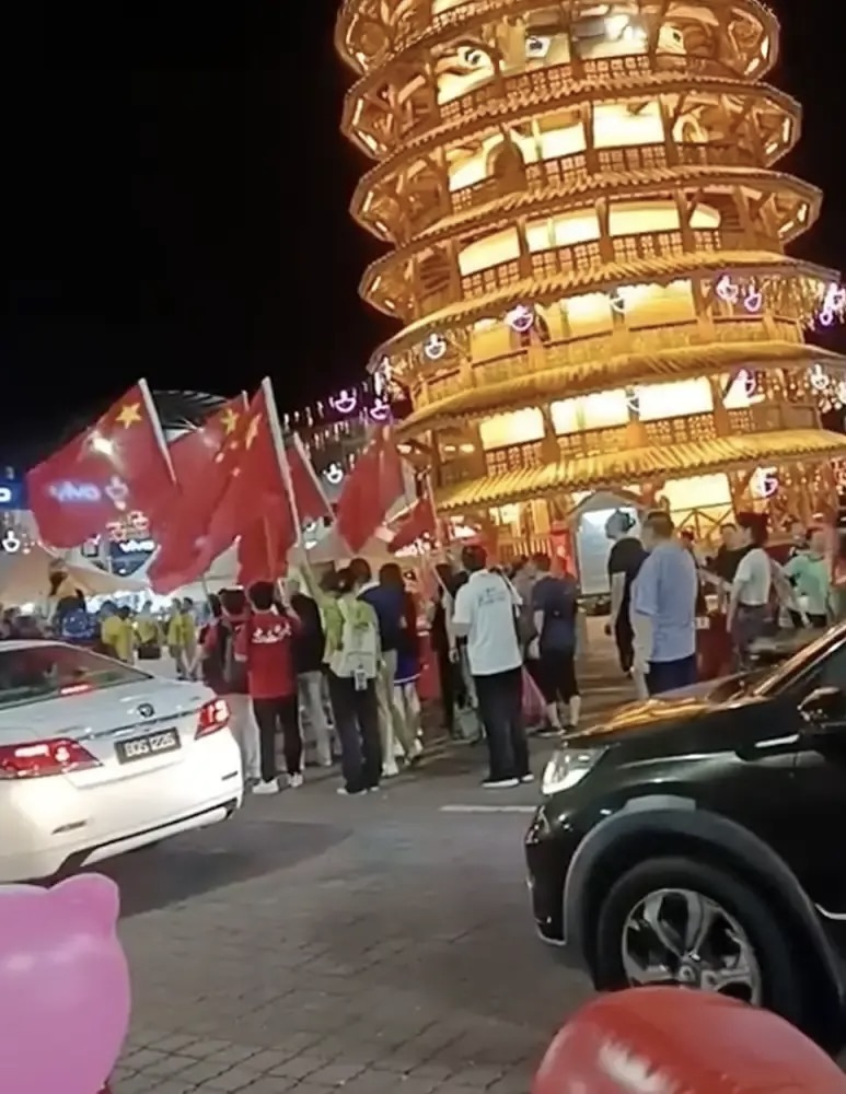 Image from: Organiser of controversial Teluk Intan event where participants waved the China flag may face up to 6 months in jail