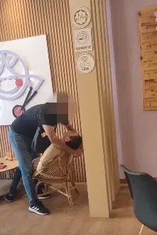 Image from: Assaulting a man in viral video, alleged Johor police station chief may face up to 1-year jail, RM2k fine or both