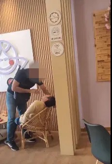 Image from: Assaulting a man in viral video, alleged Johor police station chief may face up to 1-year jail, RM2k fine or both