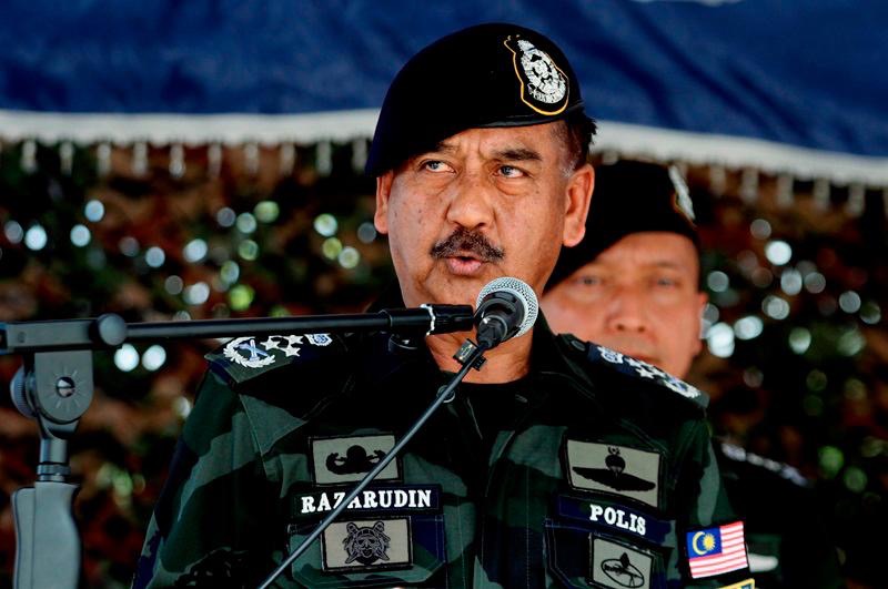 Image from: Suspect behind video of Jalur Gemilang being taken down & replaced with Sabah, Sarawak flags may face up to 3-year jail