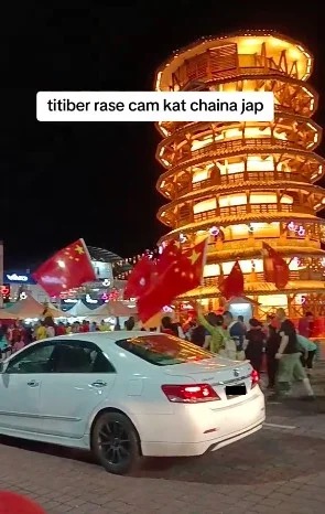 Image from: The foreigners who waved China flags at viral Teluk Intan parade can face up to 6 months in jail and RM10,000 fine