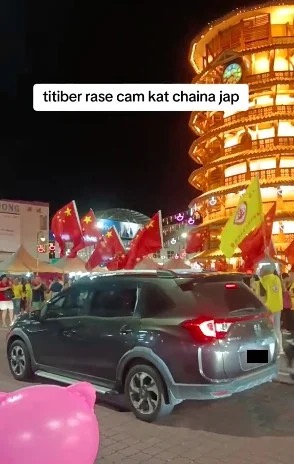 Image from: The foreigners who waved China flags at viral Teluk Intan parade can face up to 6 months in jail and RM10,000 fine