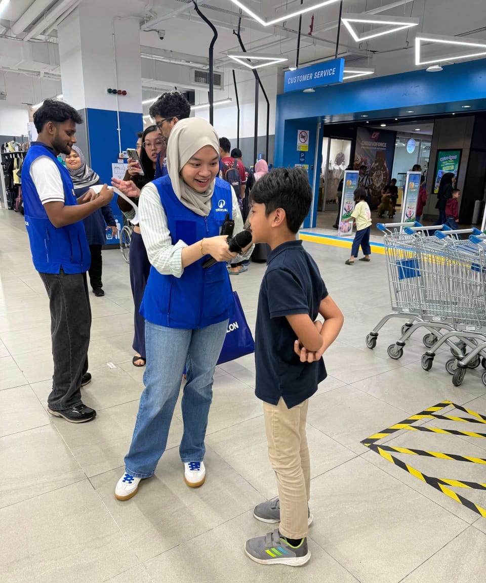 Image from: #GilaBola | Izz Fayyadh won a cash voucher gift at Decathlon Cyberjaya Store's Run for BELANG 2026 to celebrate World Cup
